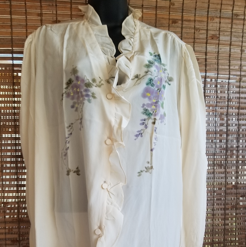 Cream silk shirt.